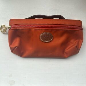 Longchamp mini bag, about the size of a glasses case. “Le Pliage” style